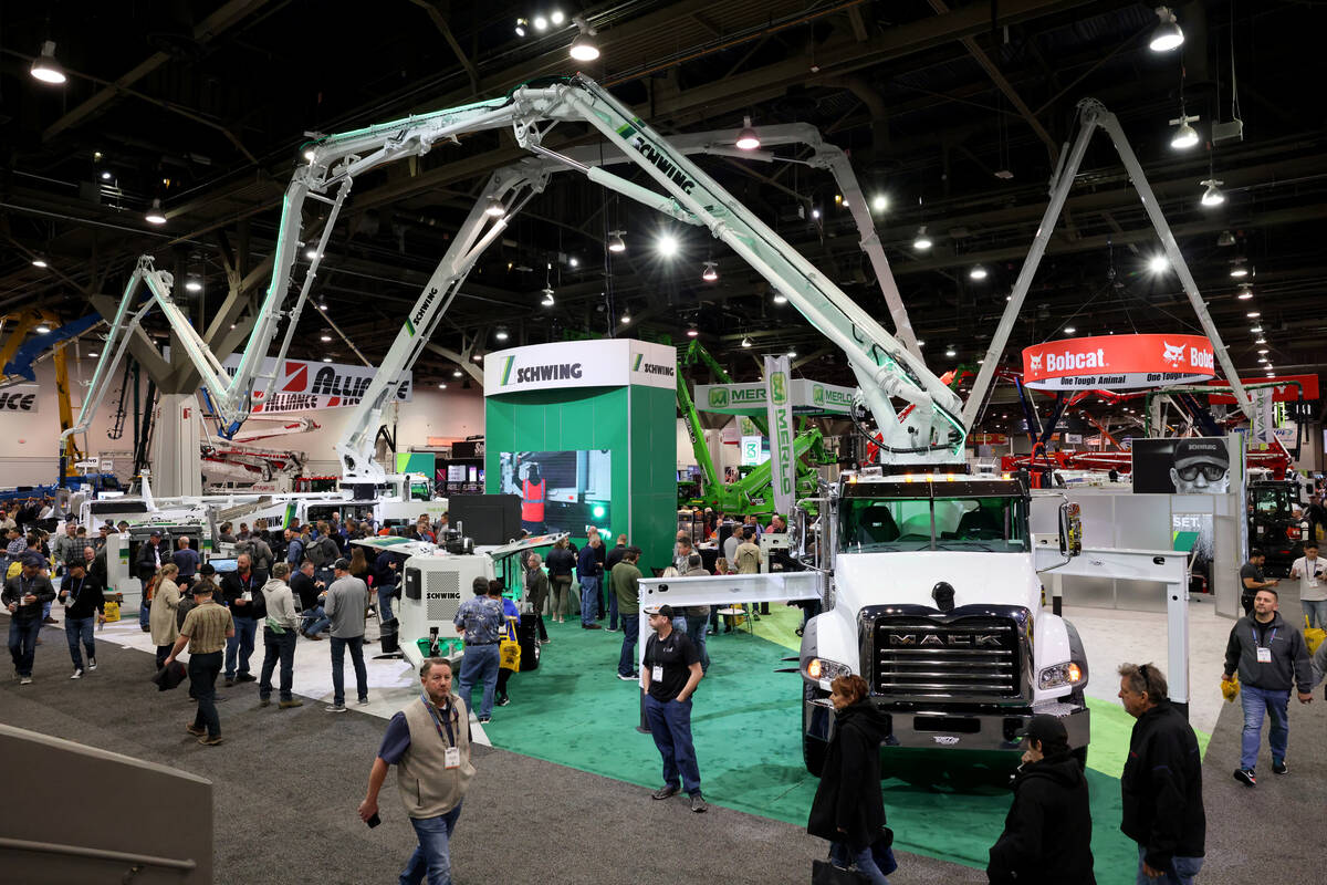 Conventioneers check out concrete pumping rigs on Day 1 of World of Concrete at the Las Vegas C ...