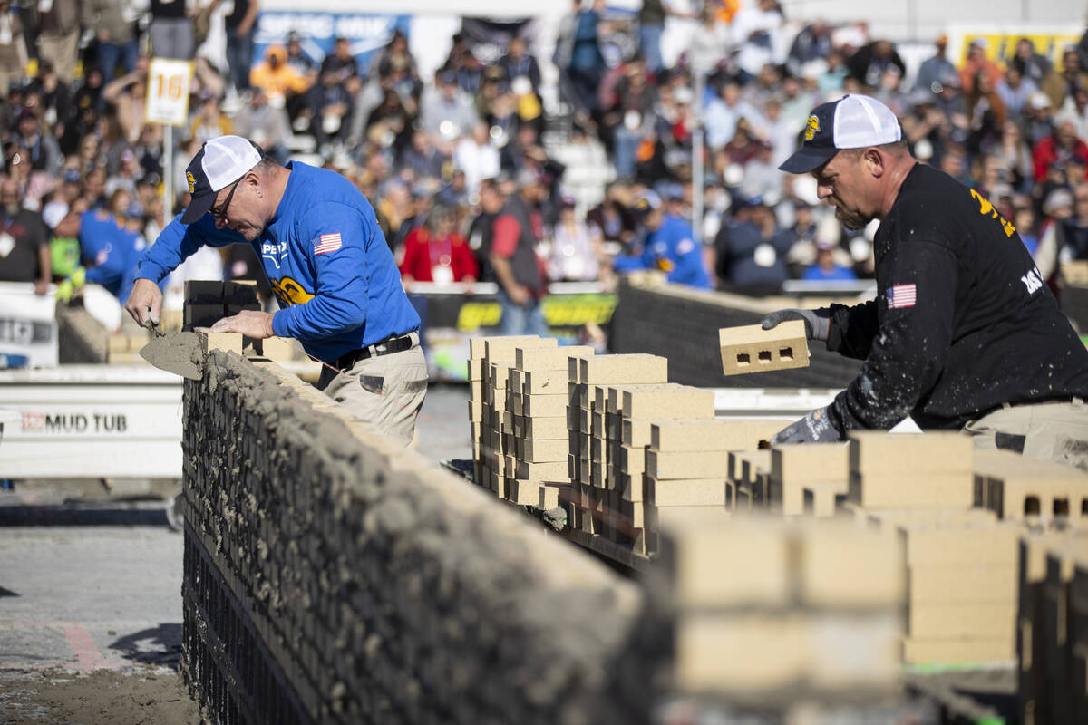 Eric Kent, left, and his tender Brandon Honold, participate in the World of Concrete Convention ...