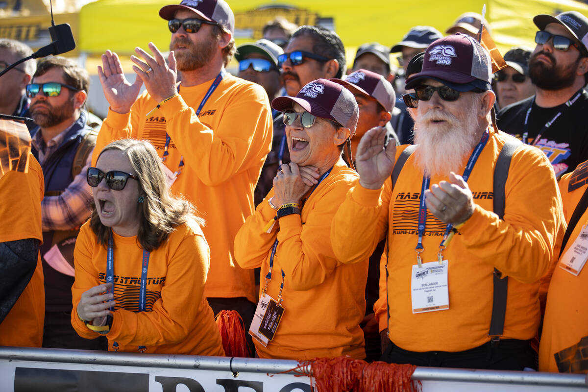 People watch the World of Concrete Convention bricklaying competition trophy is displayed at th ...