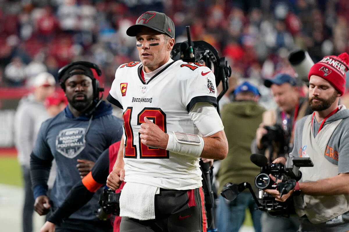 Tampa Bay Buccaneers quarterback Tom Brady (12) leaves the field after an NFL wild-card footbal ...