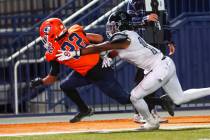 Bishop Gorman’s Micah Kaapana (22) runs the ball to score a touchdown past Desert Pines& ...