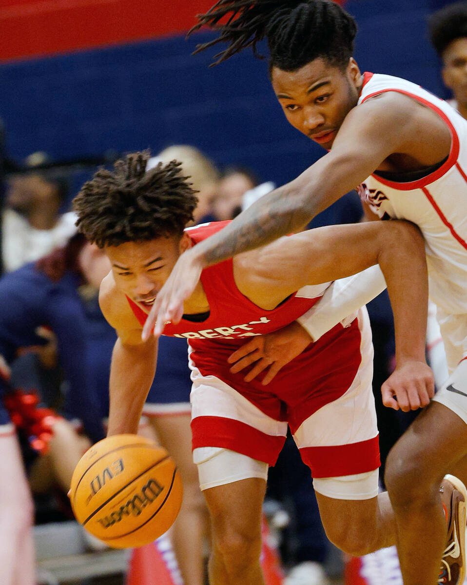 Liberty’s Dedan Thomas Jr., left, keeps a ball away from Coronado’s Sebastian Mack during t ...