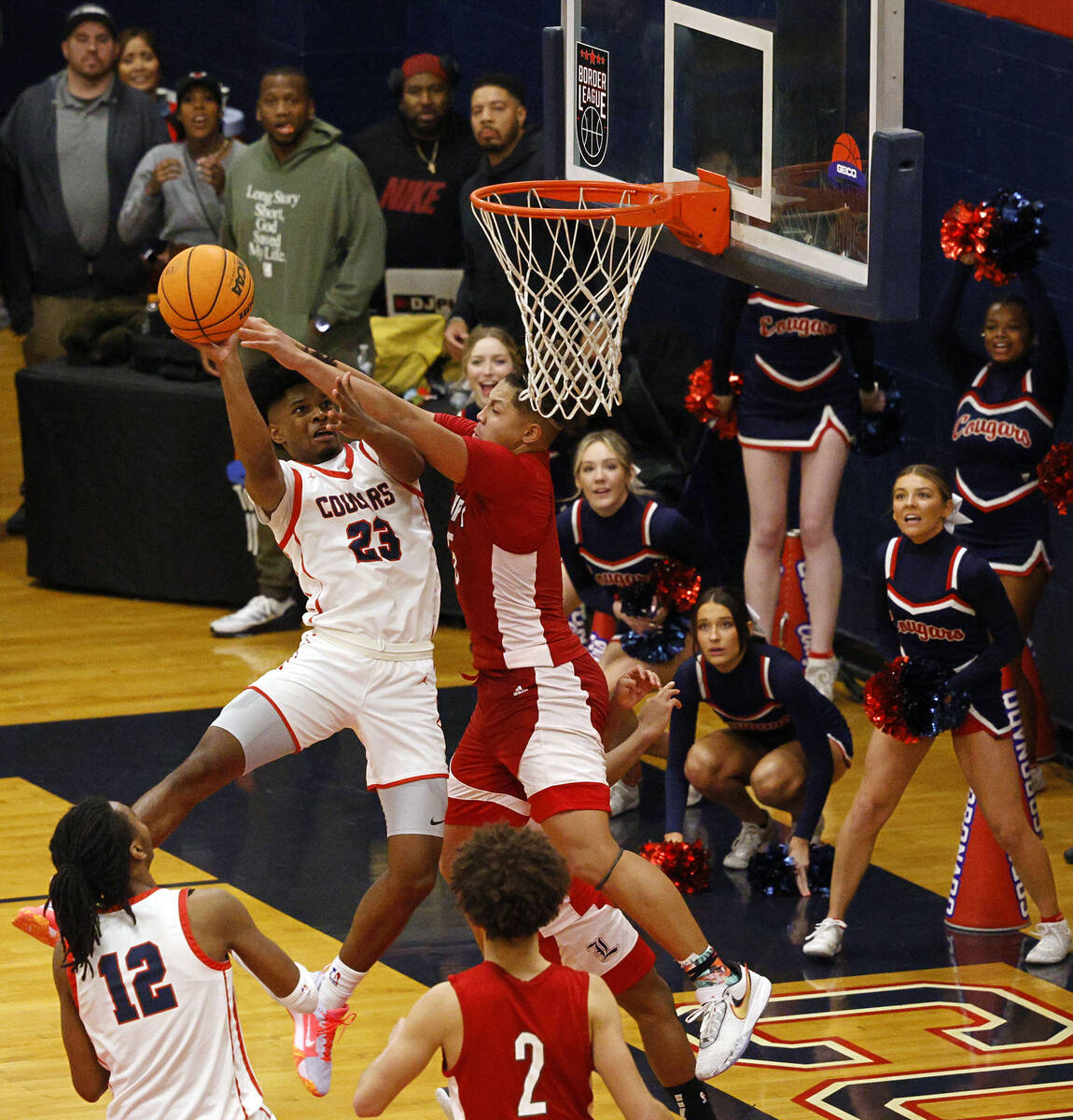 Coronado’s Josiah Cunningham (23) attempts a jump shot as Liberty’s Andre Porter ...