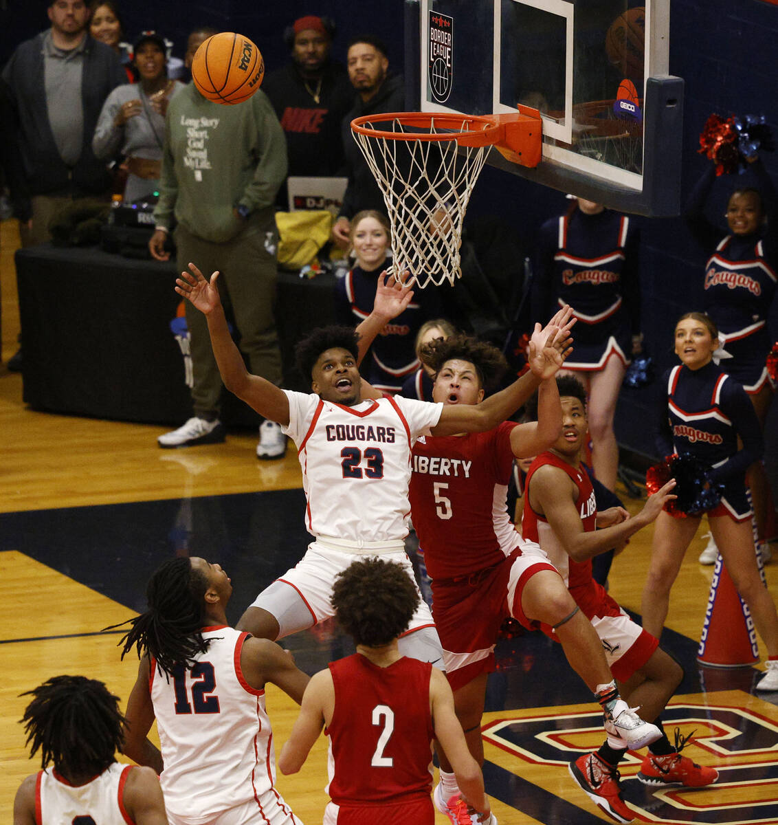 Coronado’s Josiah Cunningham (23) attempts a jump shot as Liberty’s Andre Porter ...