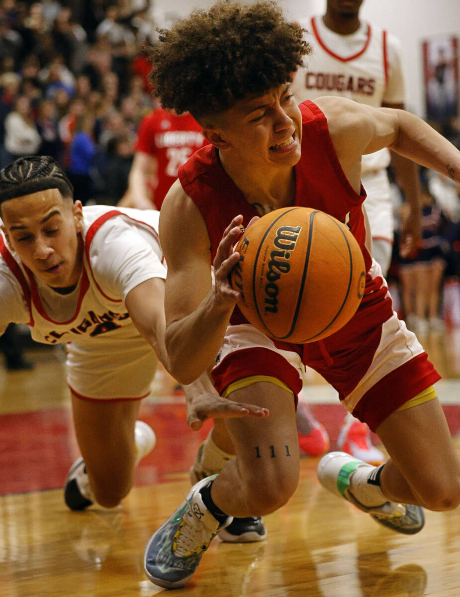 Liberty’s Angelo Kambala, right, drives past Coronado’s JC Brooks during the firs ...