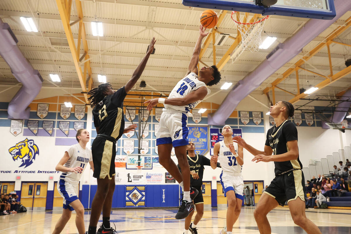 Sierra Vista's Immanuel Reed (10) defends against Spring Valley's Jordon Cosby (13) during a b ...