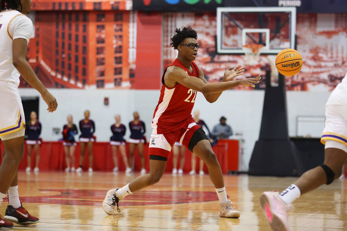 Liberty's Javares Reid (22) makes a pass in the first half of a Big City Showdown boy's basketb ...