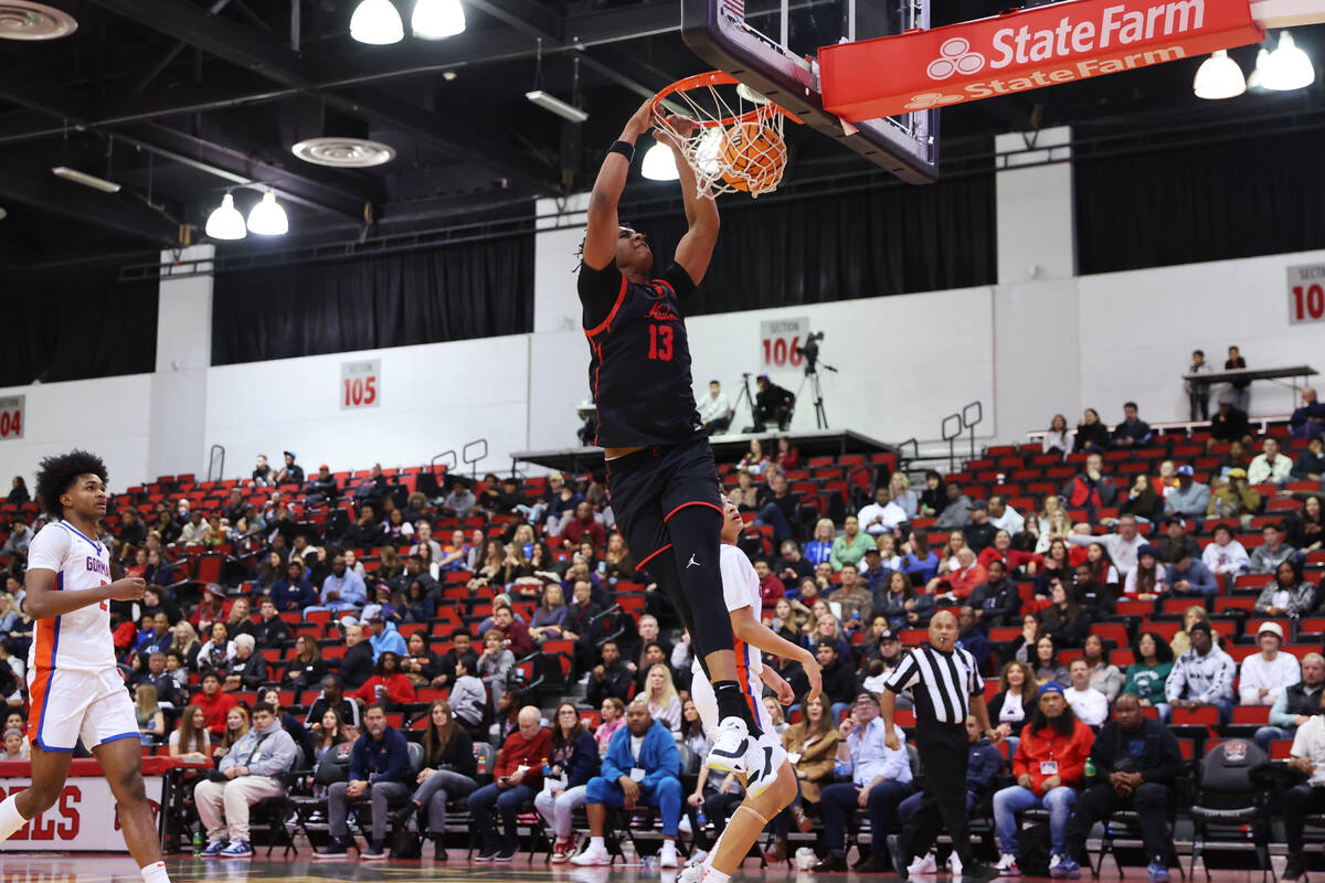 Coronado's (13) dunks the ball for a score during the second half of a Big City Showdown boy's ...