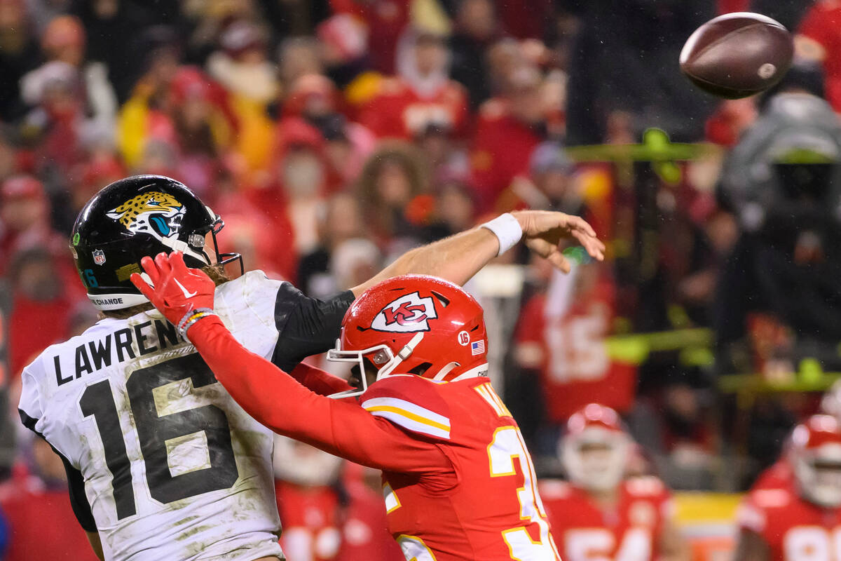 Kansas City Chiefs cornerback Jaylen Watson (35) pressures Jacksonville Jaguars quarterback Tre ...