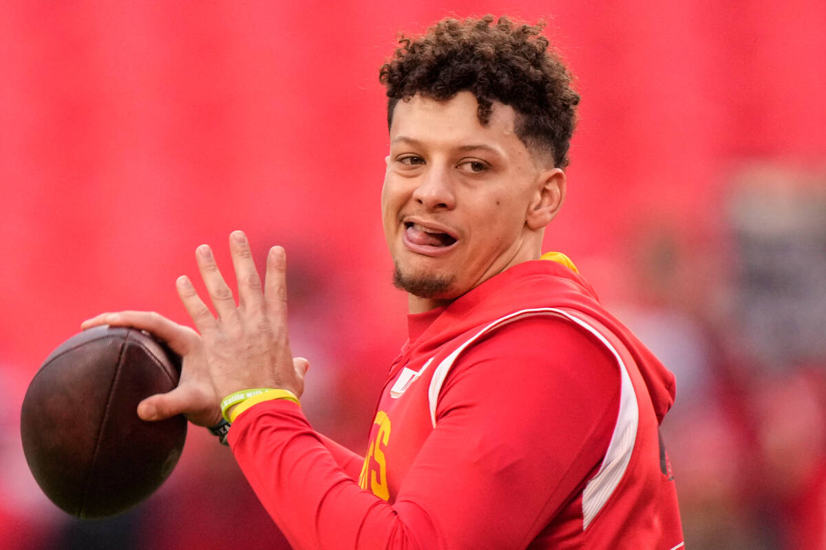 Kansas City Chiefs quarterback Patrick Mahomes warms up before an NFL divisional round playoff ...