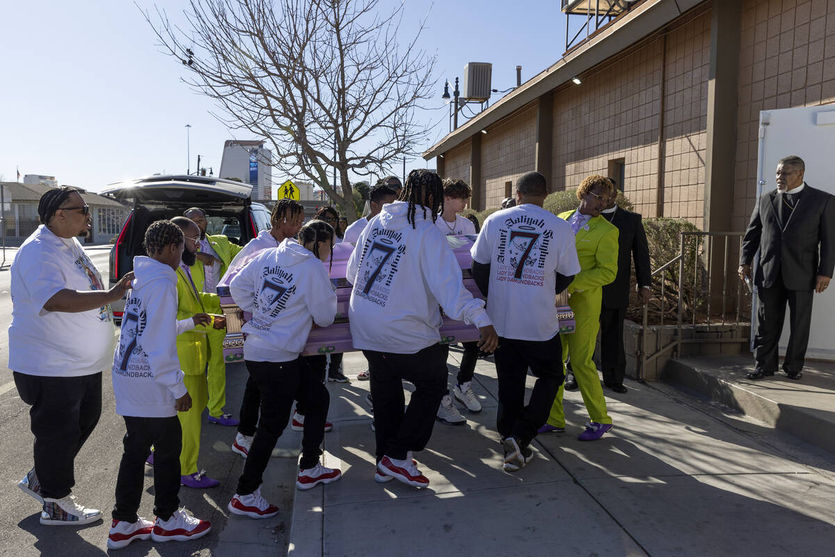 Loved ones of Ashari Hughes carry the 16-year-old’s casket in for her memorial at New Be ...