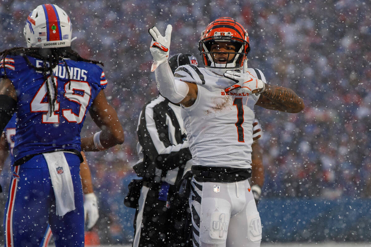 Cincinnati Bengals wide receiver Ja'Marr Chase (1) signals for a first down during an NFL divis ...