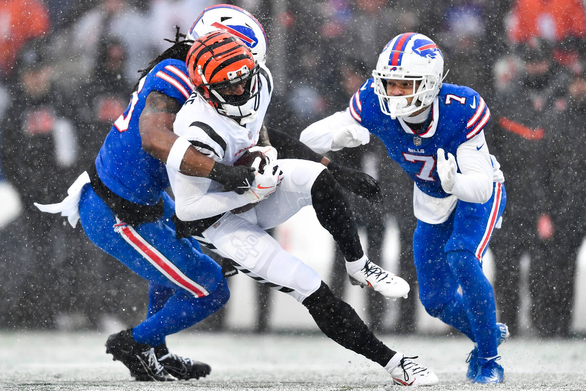 Cincinnati Bengals wide receiver Ja'Marr Chase (1) makes a catch against Buffalo Bills lineback ...