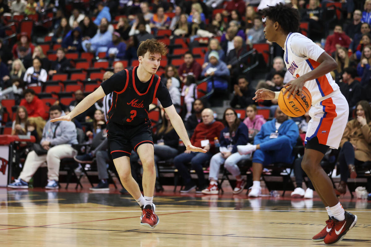 Coronado's Blake Sullivan (3) defends against Bishop Gorman's Nick Jefferson (10) during the se ...