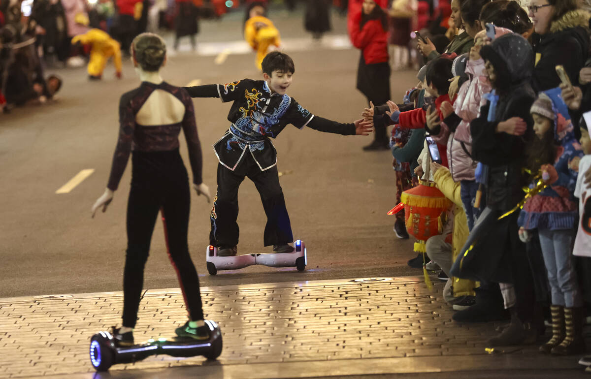 Members of K-Star Training Academy ride on hoverboards during Downtown Summerlin's Lunar New Y ...