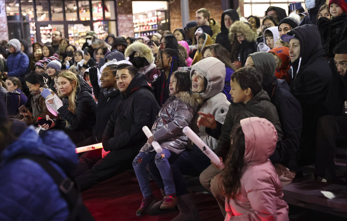 People watch as members of K-Star Training Academy perform during Downtown Summerlin's Lunar Ne ...