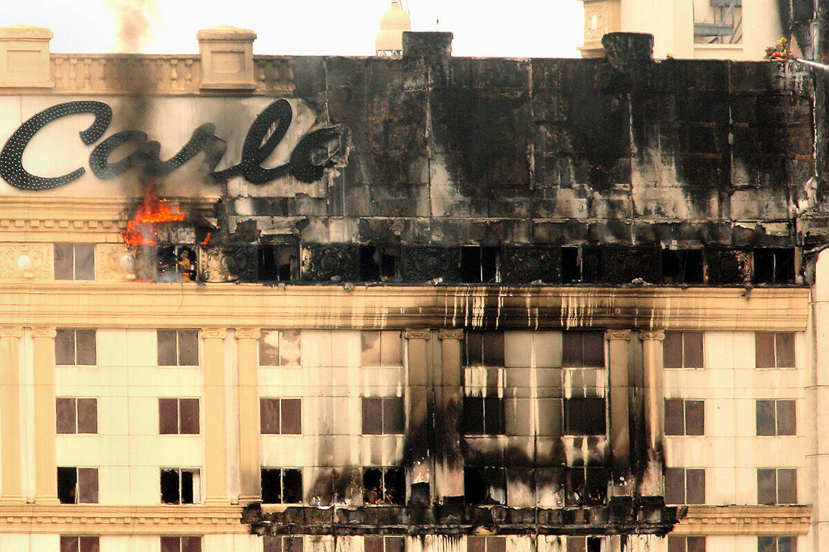 Flames and smoke rise from the Monte Carlo hotel-casino on the Las Vegas Strip after a fire bro ...