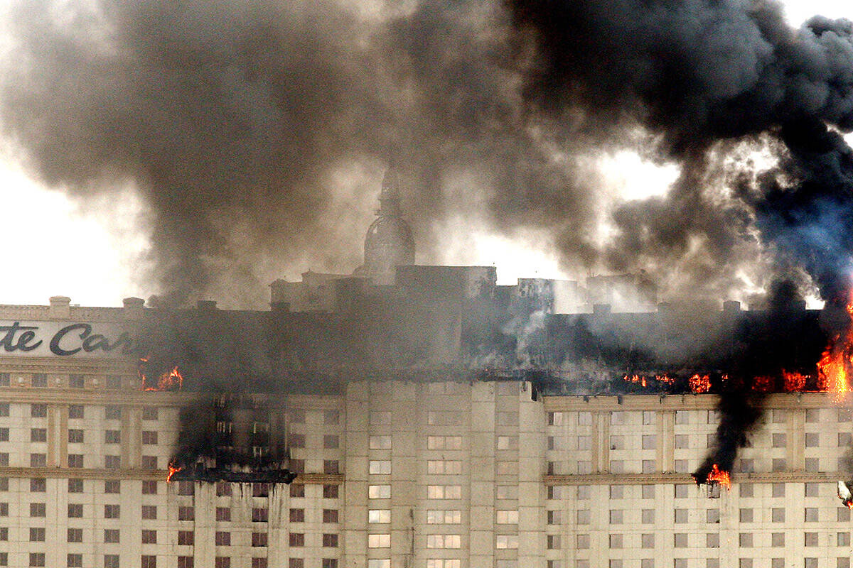 Flames and smoke rise from the Monte Carlo hotel-casino in Las Vegas after a fire broke out on ...