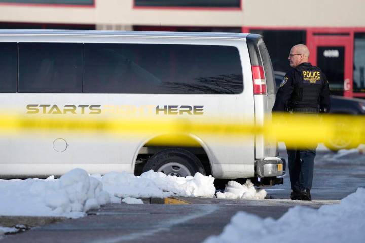 A law enforcement officer walks outside the Starts Right Here building, Monday, Jan. 23, 2023, ...