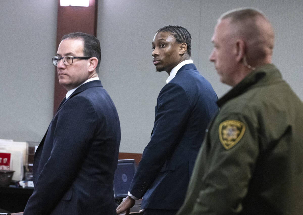 Ex-Raiders wide receiver Henry Ruggs, center, appears in court with his attorneys Richard Schon ...