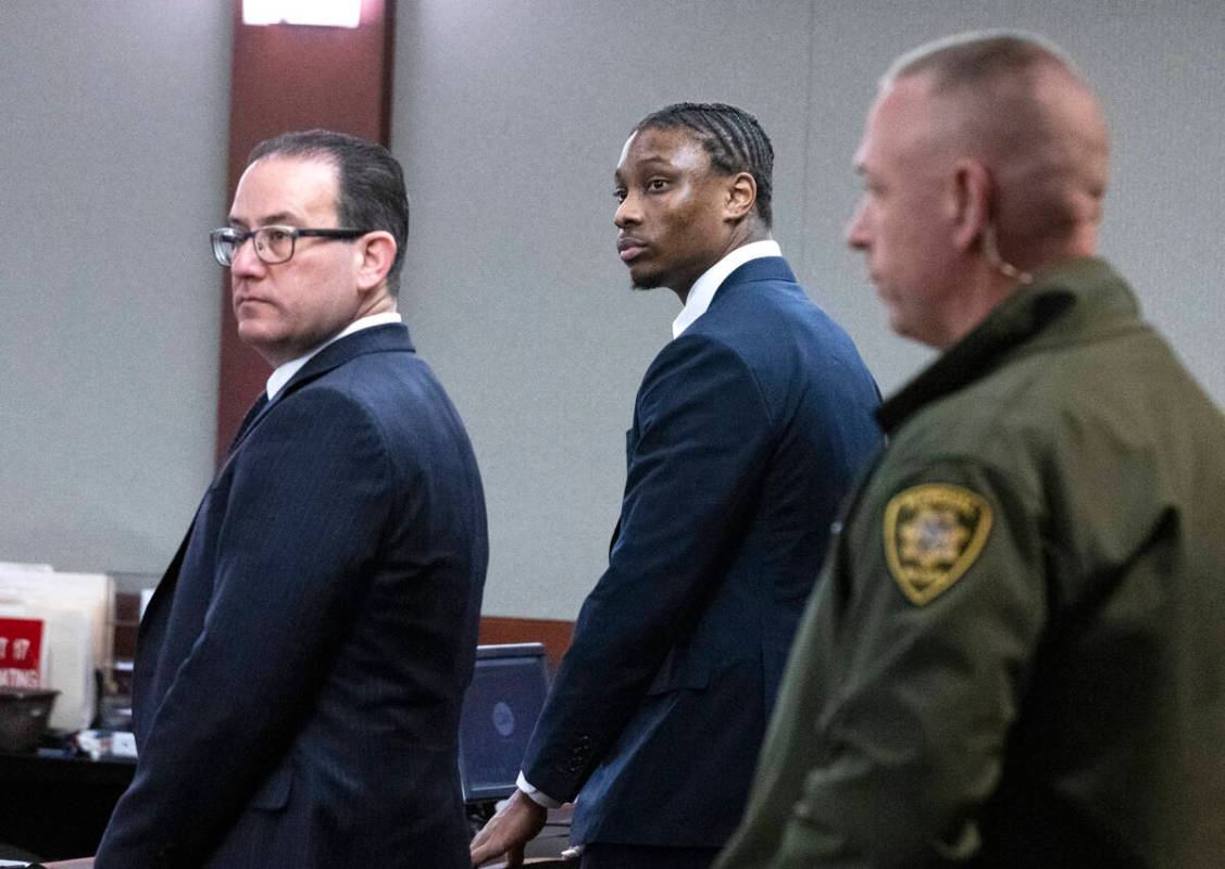 Ex-Raiders wide receiver Henry Ruggs, center, appears in court with his attorneys Richard Schon ...