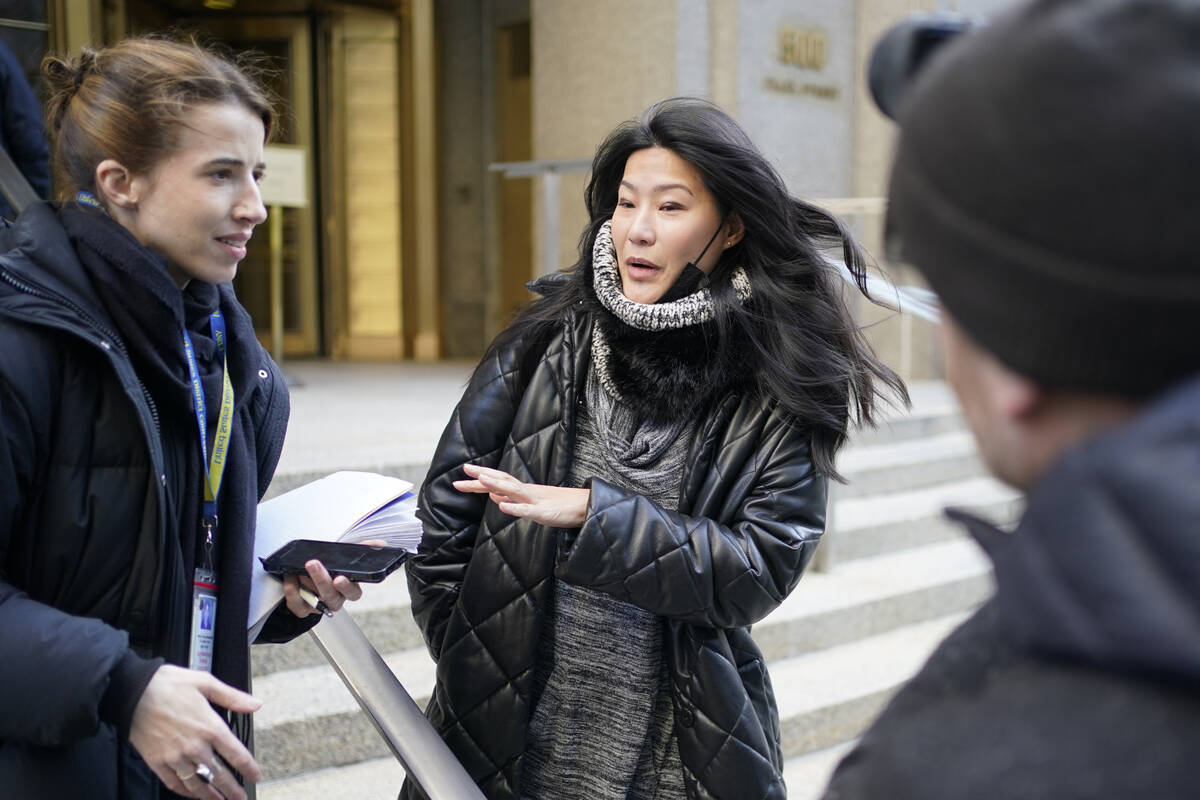 Evelyn Yang, center, a former patient of Dr. Robert Hadden, speaks to reporters following Hadde ...