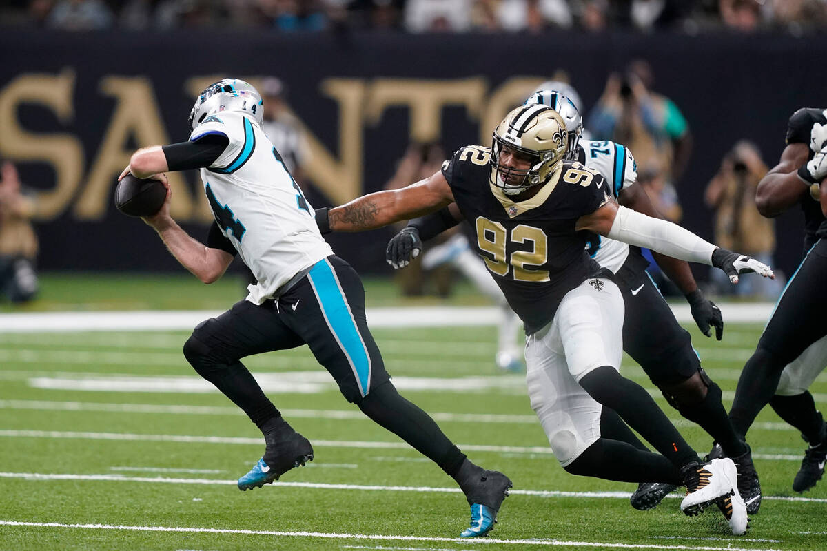 New Orleans Saints defensive end Marcus Davenport (92) pursues Carolina Panthers quarterback Sa ...