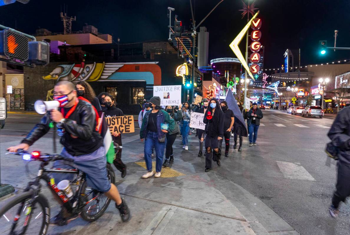 Participants march and chant along Fremont Street during a rally for Tyre Nichols organized by ...