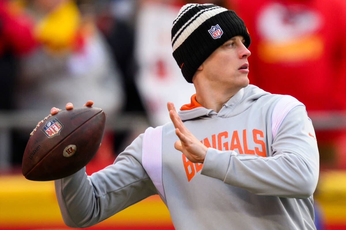 Cincinnati Bengals quarterback Joe Burrow throws during warmups before the NFL AFC Championship ...