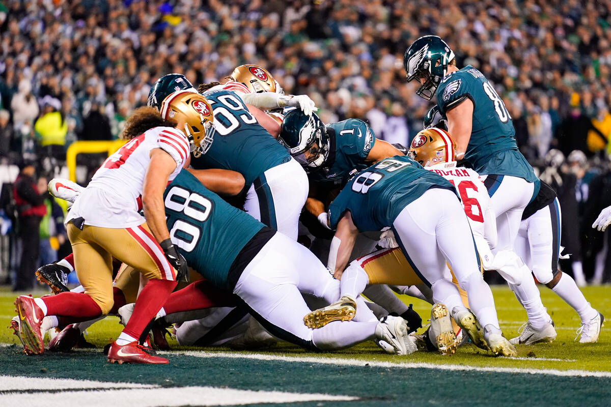 Philadelphia Eagles quarterback Jalen Hurts (1) scores during the second half of the NFC Champi ...