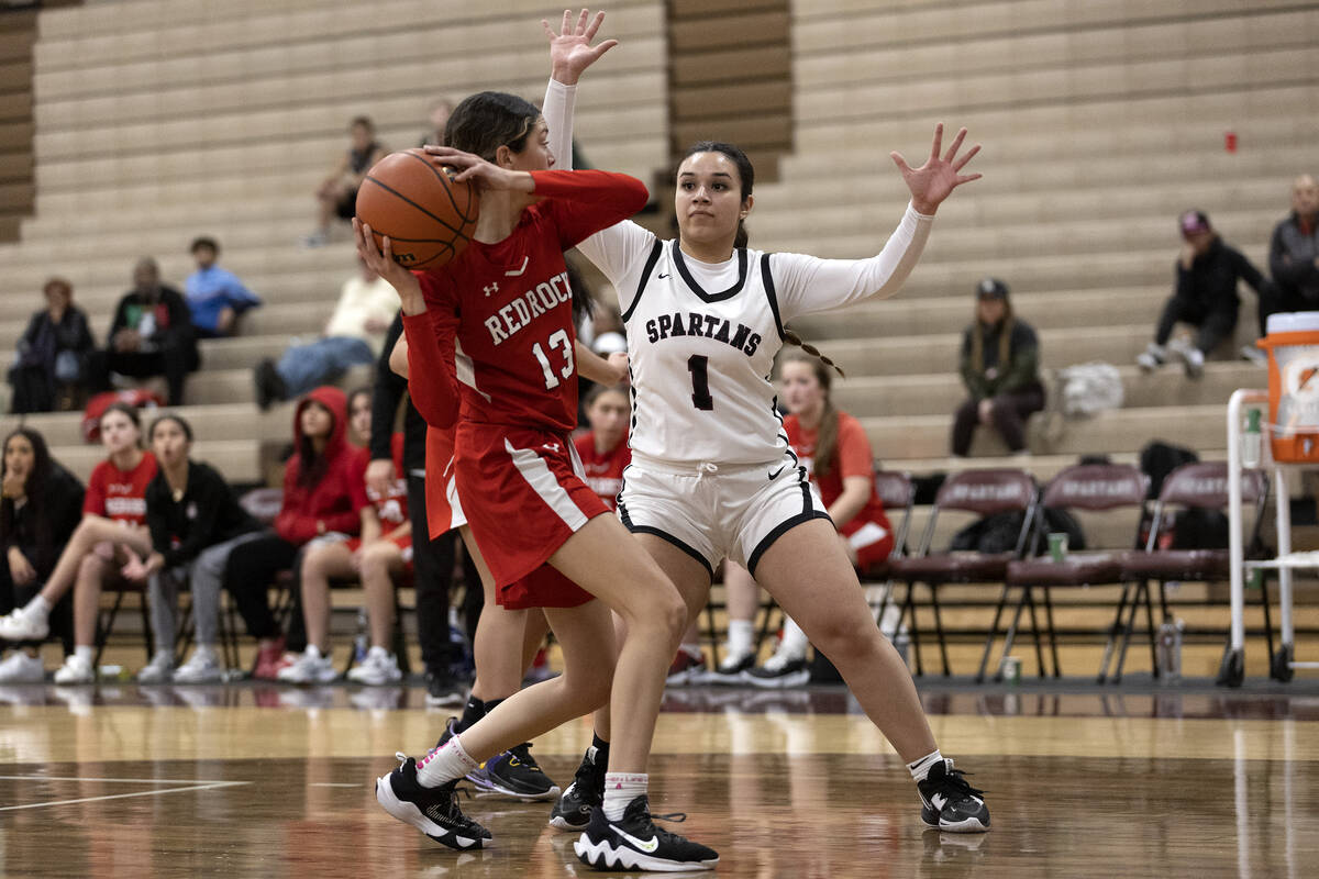 Doral’s Peyton Gomez (13) looks for a teammate to pass to while Cimarron-Memorial&#x2019 ...