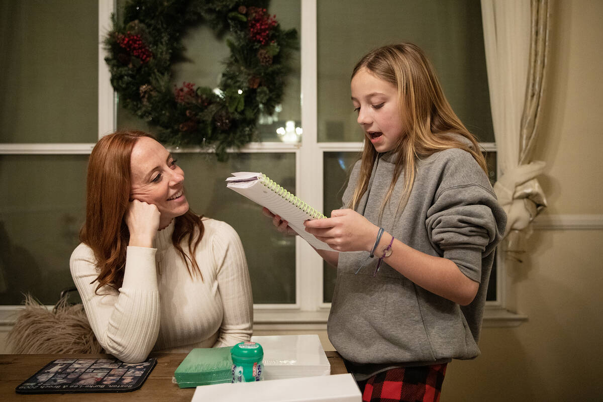 Ann Mabeus laughs with her daughter Bree-Ann Mabeus, 11, as she reads from her schoolwork. (Rac ...