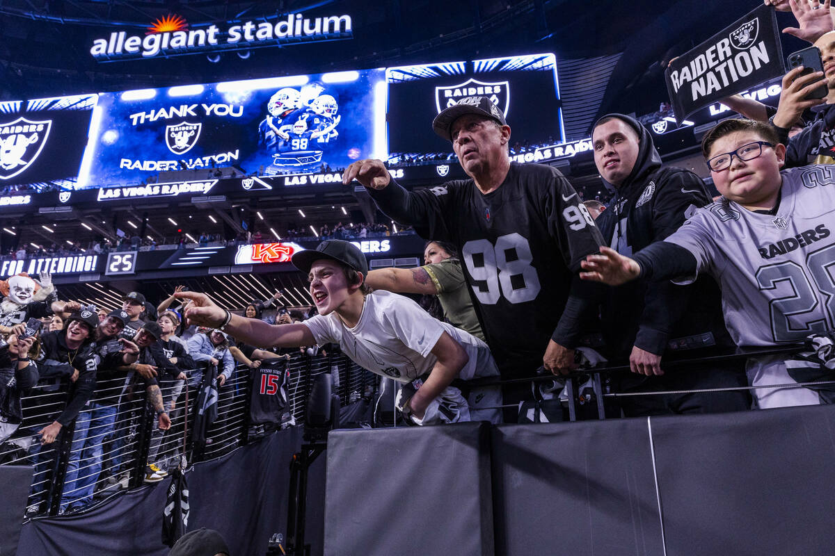 Raiders fans call to the players once more following the second half against the Kansas City Ch ...