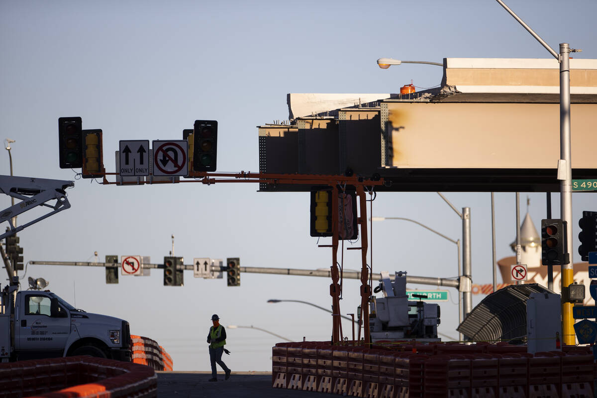 The Tropicana Avenue exit is closed as workers demolish the bridge, in Las Vegas, on Saturday, ...