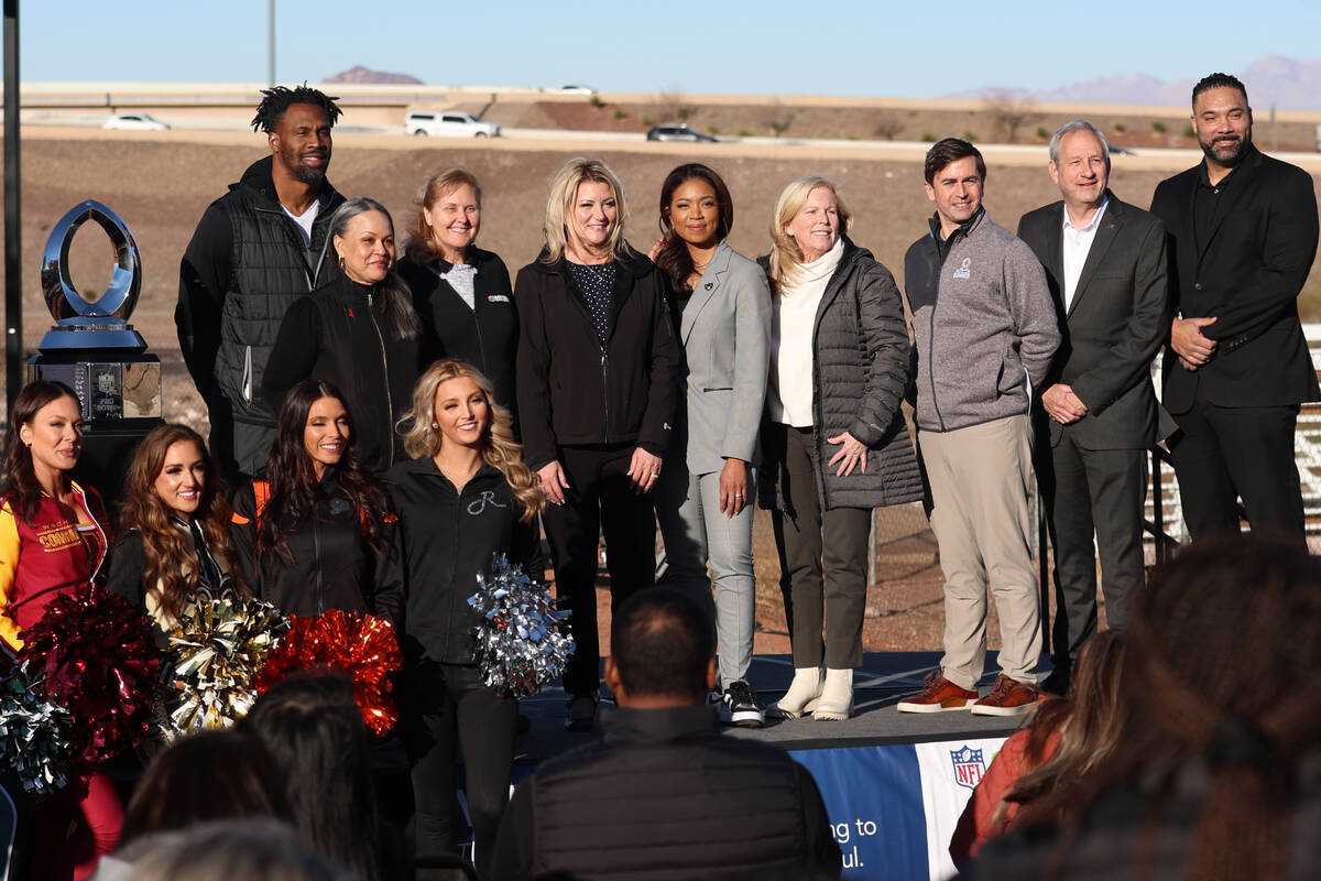 People pose during a NFL Pro Bowl week kickoff press conference and tree planting event at Acac ...