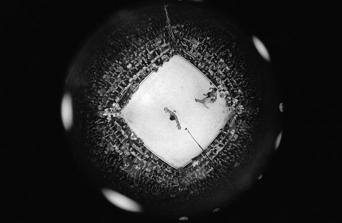 This ?fish-eye? camera view from the rafters shows the scene as referee Harry Krauch ended the ...