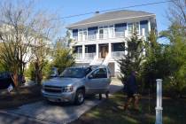 FILE - U.S. Secret Service agents are seen in front of Joe Biden's Rehoboth Beach, Del., home o ...