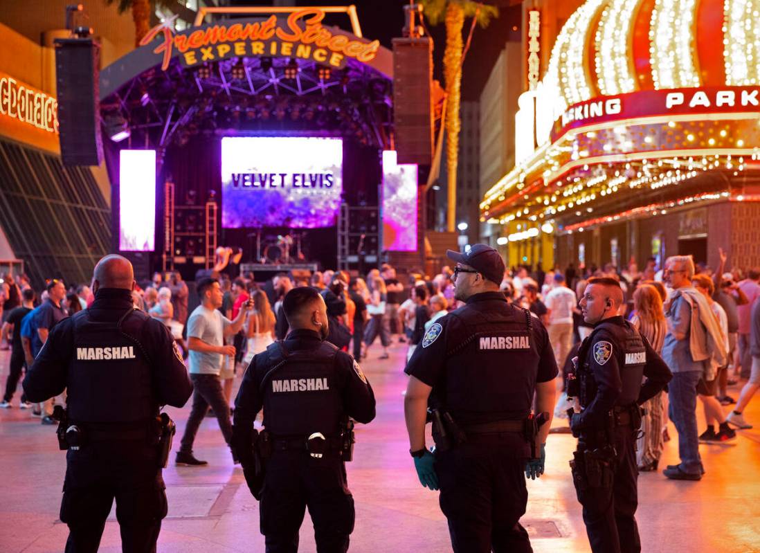 Deputies with the Las Vegas Marshals Office patrol the Fremont Street Experience on Saturday, J ...