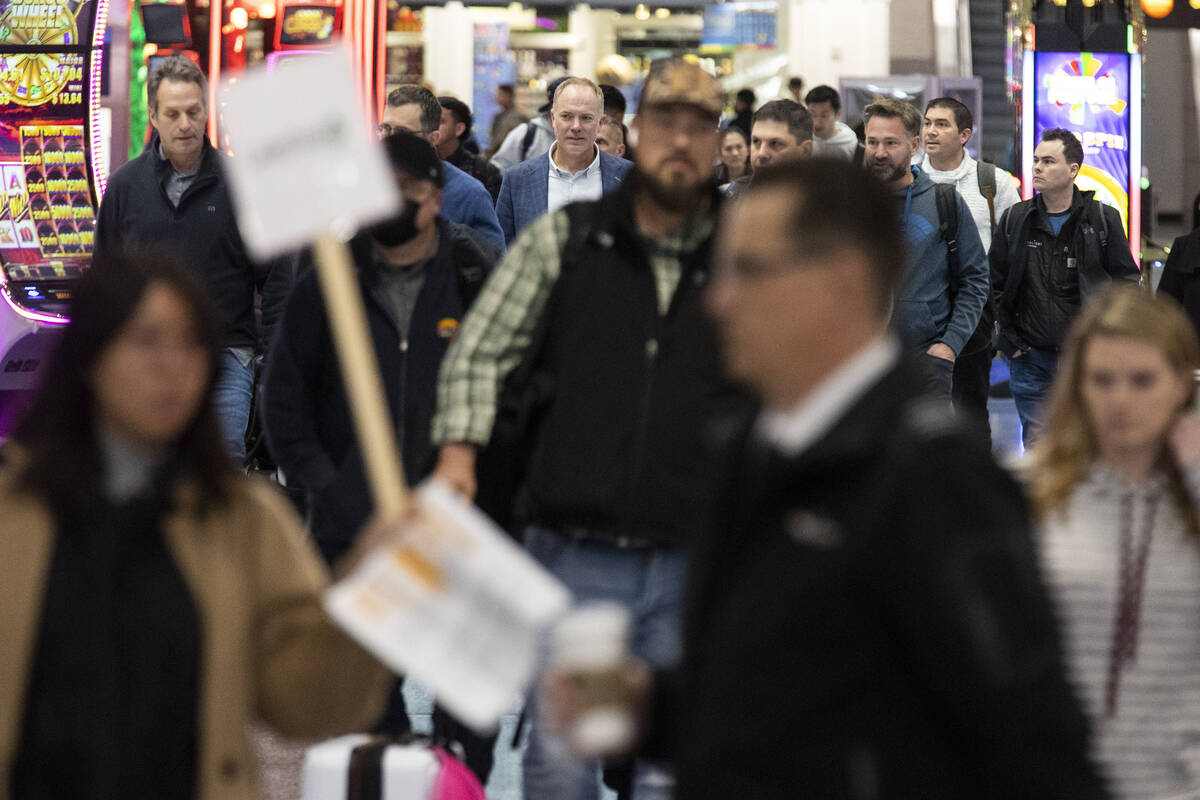 People arrive to the baggage claim area of Terminal 1 at Harry Reid International Airport in La ...