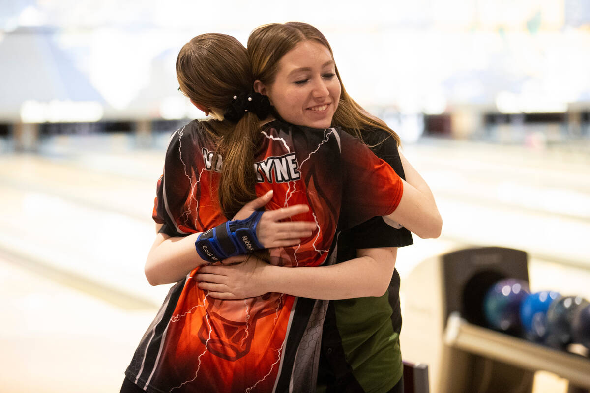 Palo Verde's Ryann Clark, right, embraces second place winner, Arbor View's Mya Van Ryne, after ...