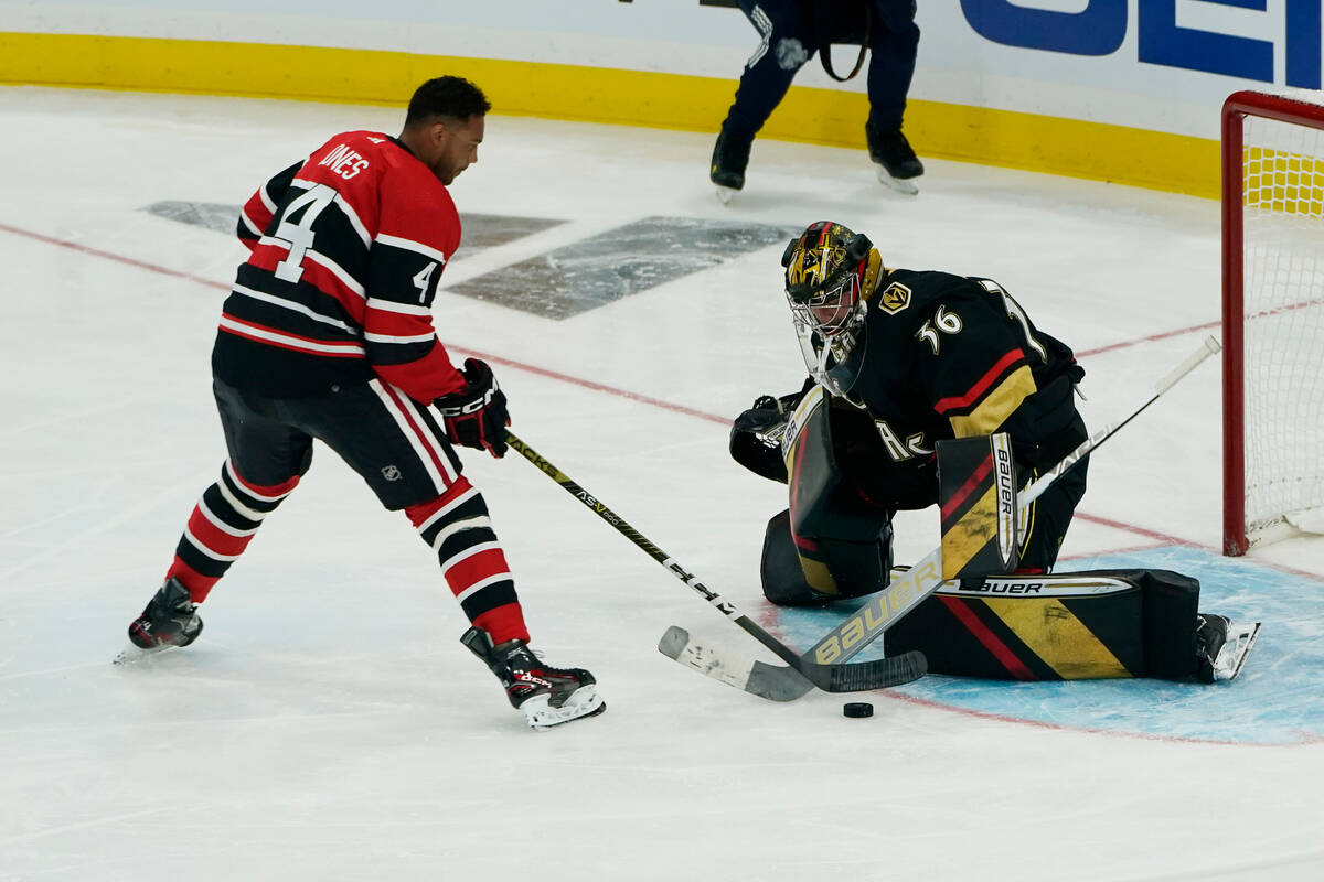 Las Vegas Golden Knights goaltender Logan Thompson (36) stops a shot on goal by Chicago Blackha ...