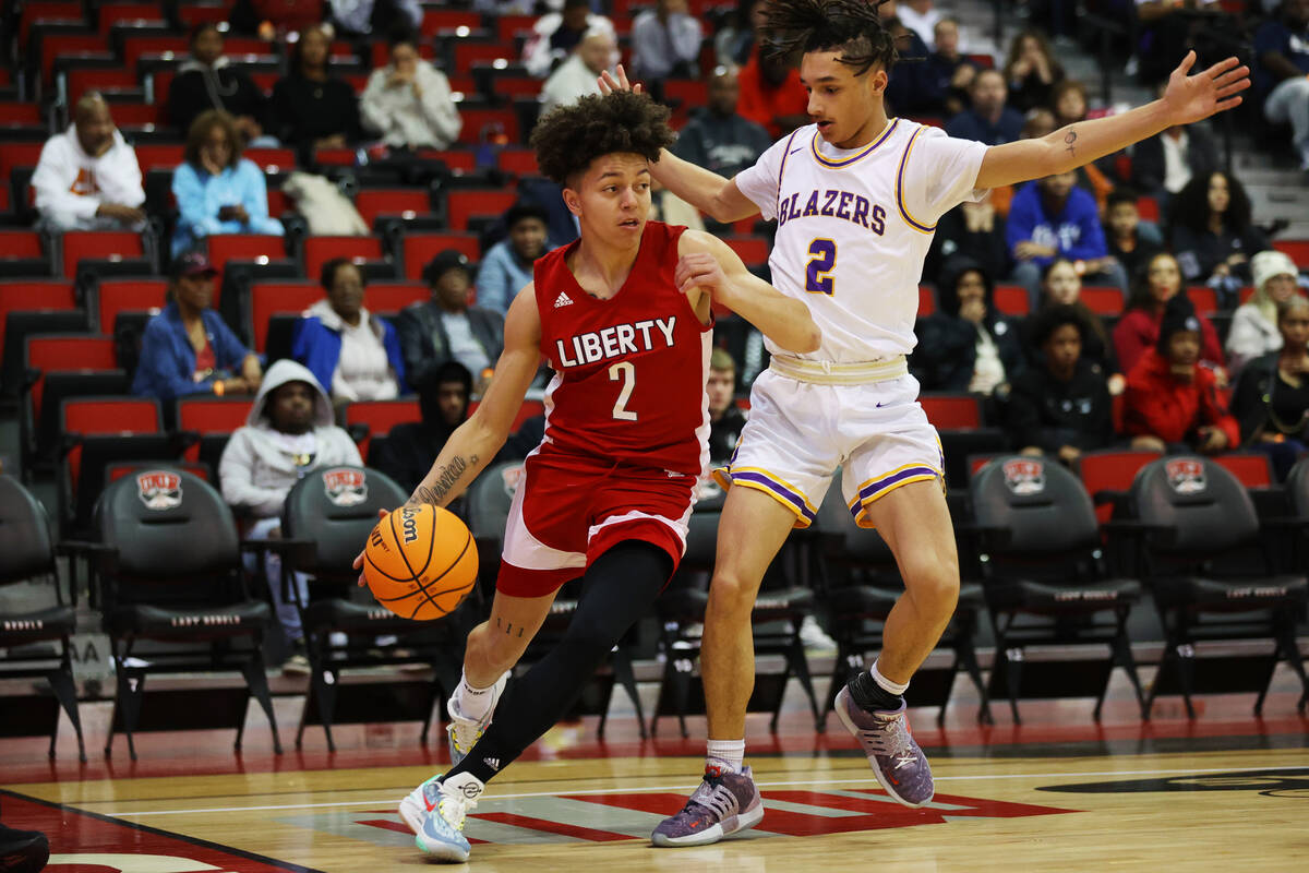 Liberty's Angelo Kambala (2) dribbles the ball past Durango's Mason Brown (2) during the first ...