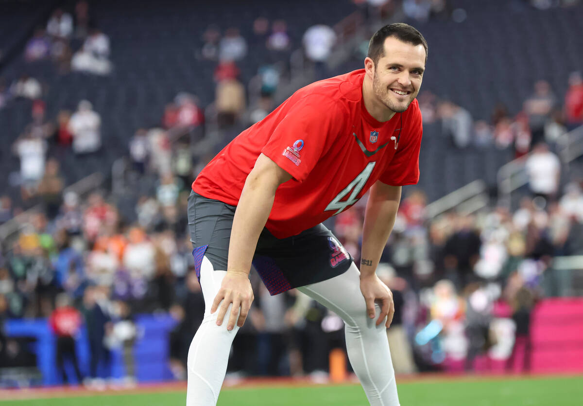 Las Vegas Raiders quarterback Derek Carr looks on while warming up before the NFL Pro Bowl Game ...