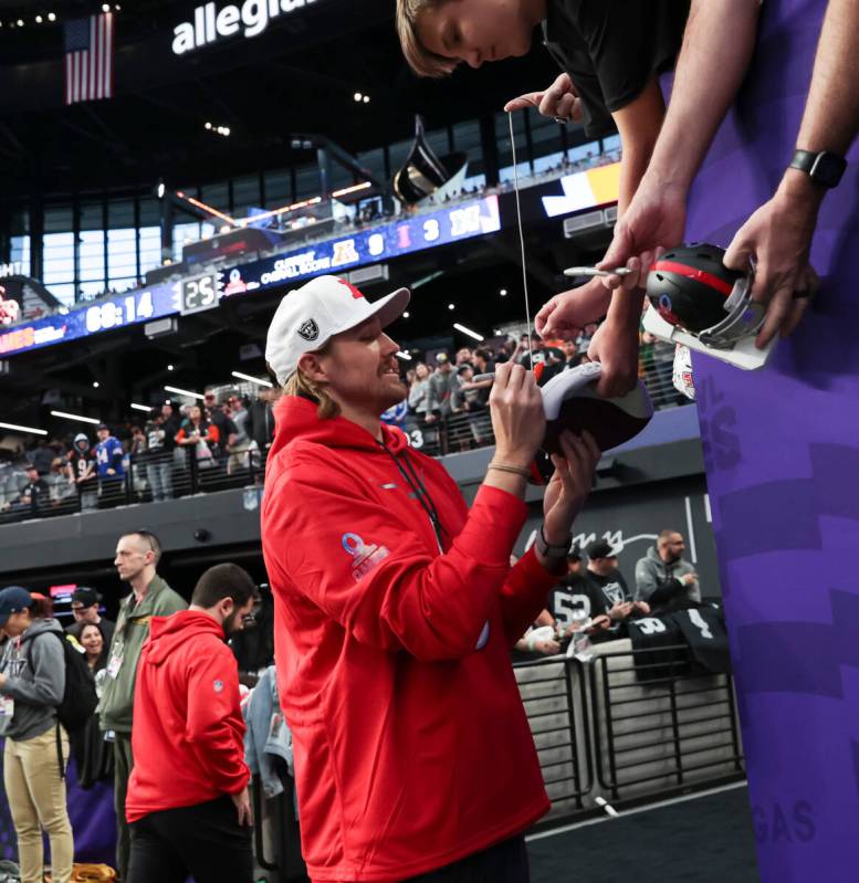 Las Vegas Raiders punter A.J. Cole III (6) signs items for fans before the NFL Pro Bowl Games a ...