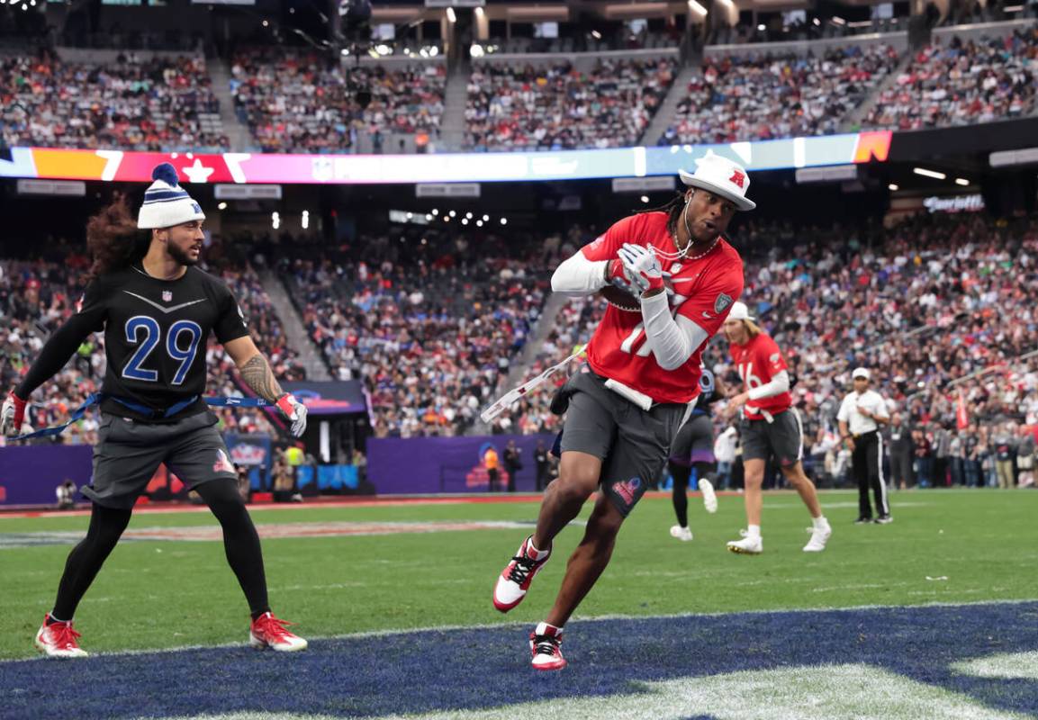 Las Vegas Raiders wide receiver Davante Adams (17) scores a touchdown past San Francisco 49ers ...