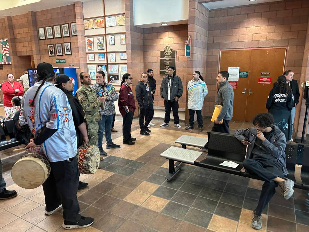 People wait outside the courtroom before a hearing for Nathan Chasing Horse in North Las Vegas ...