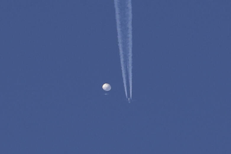 In this photo provided by Brian Branch, a large balloon drifts above the Kingstown, N.C. area, ...