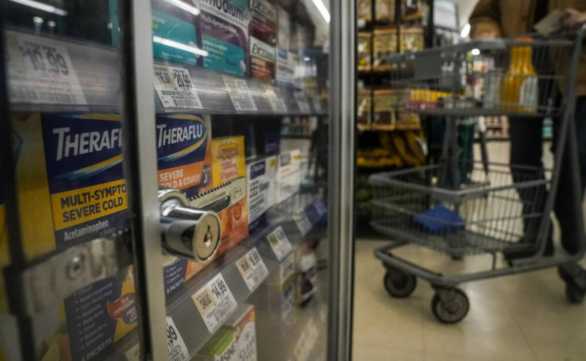 Pharmaceutical items are kept locked in a glass cabinet at a Gristedes supermarket, Tuesday Jan ...