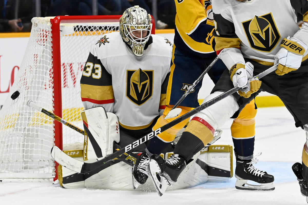 Vegas Golden Knights goaltender Adin Hill (33) deflects a Nashville Predators shot during the s ...