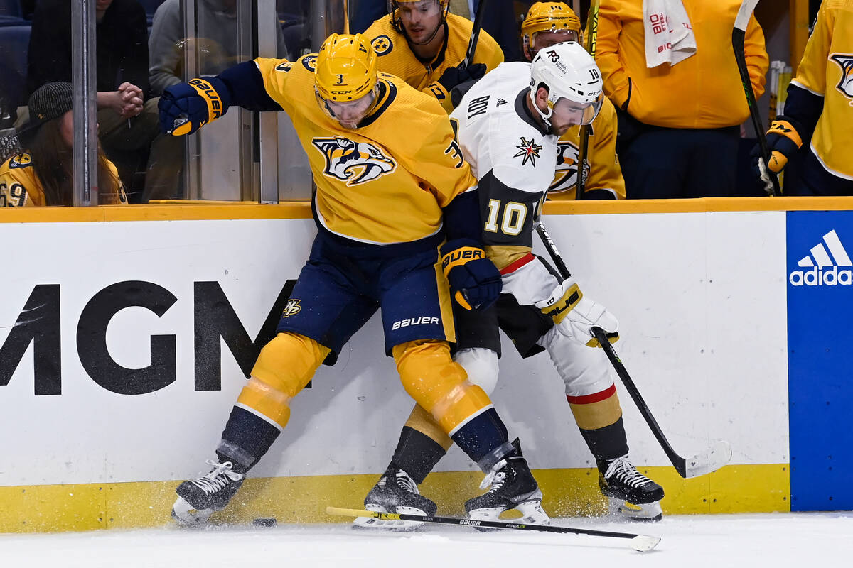 Nashville Predators defenseman Jeremy Lauzon (3) loses his stick as he works for the puck again ...